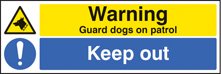 Warning guard dogs on patrol keep out