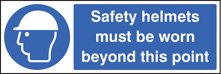 Safety helmets must be worn this beyond